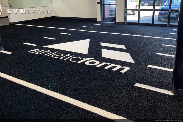 image of SYNLawn Ottawa CA prefab turf logos for athletic weight room applications